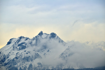 Fototapeta na wymiar Snow mountain peak view from Lake Lucerne cruise