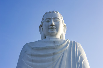 Big white meditating Amitabha Buddha statue located in Quang Minh Mahayana Buddhism temple in Da Nang, Vietnam 