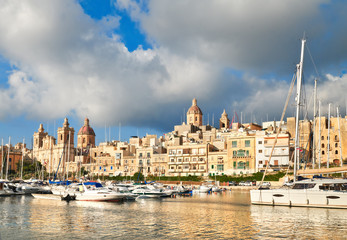 Fototapeta premium Sailing boats on Senglea marina in Grand Bay, Valetta, Malta