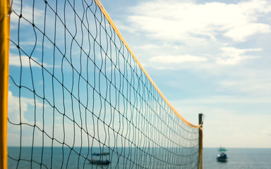 Fototapeta na wymiar Empty Beach volleyball net on the beach with a clear and sunny sky