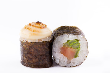 Traditional fresh Japanese sushi rolls on a white background. Roll with salmon and fresh green onions.