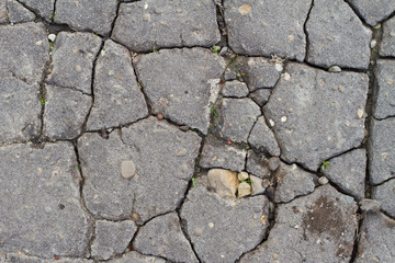 Cracked asphalt road surface texture. Grey texture of the road.