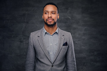 Obraz premium Classic studio portrait of black male dressed in a suit.