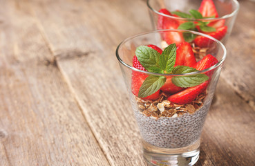 Breakfast with chia pudding, strawberries and muesli