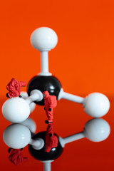 Miniature model chemical team with a molecular model of methane