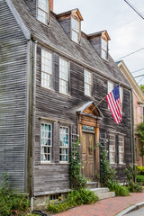 Historic New England style home displaying early American Flag in Portsmouth, NH, historic district