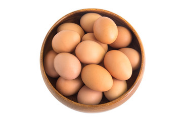 Egg in a wooden bowl isolated on white background.