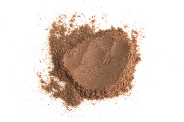 Pile cocoa powder isolated on white background.