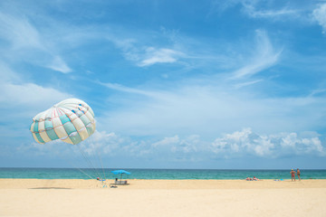 Parasailing on the beach in Karon beach Phuket Thailand, Phuket Beach Sports and Activities. Summer holiday vacation and exotic leisure experience concept. - 149541356
