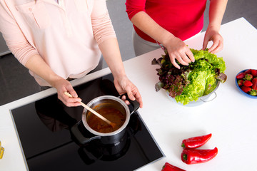women cooking together in the kitchen- from above