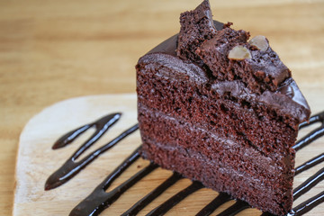 Piece of Chocolate Fudge on wooden table.