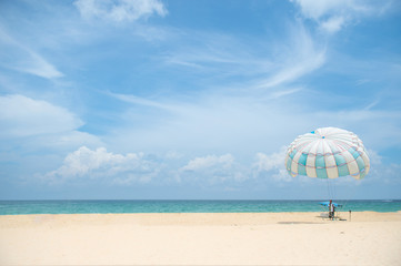 Parasailing on the beach in Karon beach Phuket Thailand, Phuket Beach Sports and Activities. Summer holiday vacation and exotic leisure experience concept. - 149557342