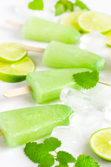 Healthy lime mint popsicles with fresh lime slices And ice cubes