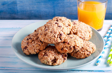 Banana, chocolate and nuts, coconut cookies on plate