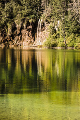 waterfall's reflection at Plitvicka lakes park, landscape of plitvice lake national park at sunset, unesco heritage site, plitvice, croatia.