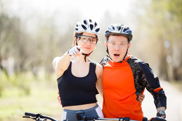 Young cyclists in protective helmets