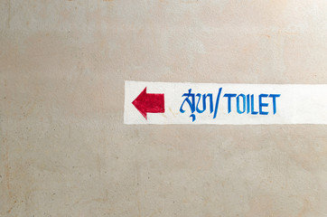 Toilet Sign on The Wall in the Traditional Temple, Thailand.
