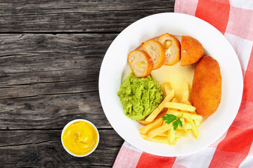 chicken rissoles, french fries, mashed pea