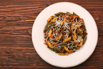 Pasta with meat, sauce and parmesan