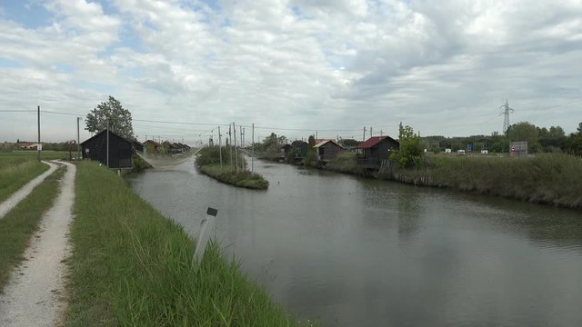 panoramic view of fishing sheds in Italian countryside