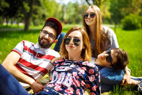 Group of young people having fun outdoors. Smile faces. Nice mood. Summer lifestyle





