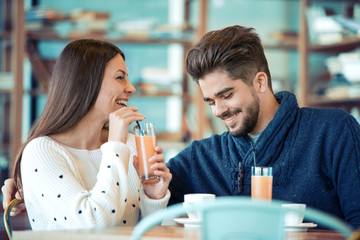 Happy couple enjoying a coffee at the coffee shop