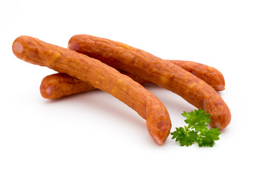 Stack of smoked sausages isolated on a white background.