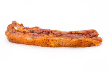 Spicy marinated spare ribs barbecued on the white background.