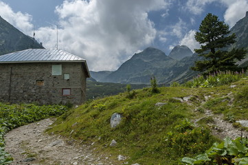 Fototapeta na wymiar View of old rest-house close up on the ecological walk toward Maliovitza peak in Rila mountain, Bulgaria 