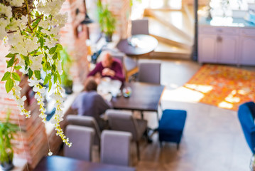 Blurred top view people having lunch in restaurant
