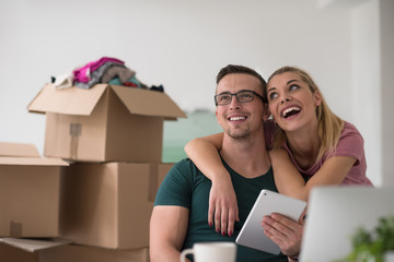 Young couple moving in a new home