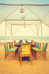 Table and chair set on the beach for dinner