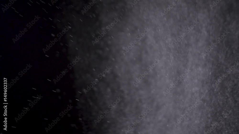 Wall mural white powder exploding isolated on black