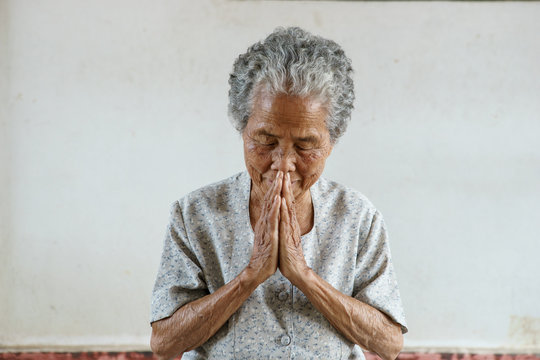 Pray of senior asian woman