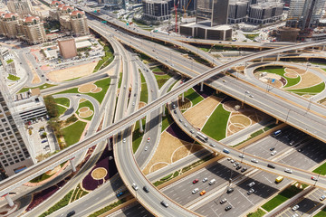 Scenic aerial view of famous highway intersection in Dubai, UAE, at day. Transportation and travel background.