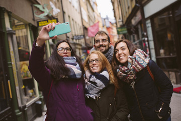 Groups of friends taking a photo selfie.
