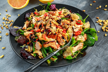 Salmon, green bean and pink grapefruit salad with balsamic vinegar drizzle and pine nuts