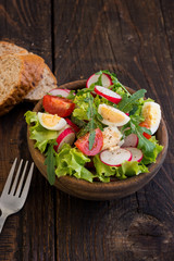 Salad of Arugula, Radishes, Tomatoes and Eggs With Vegetable Seasoning