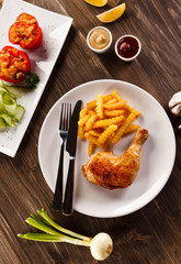 Roast chicken leg with french fries - restaurant