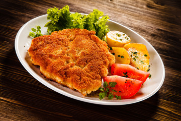 Fried pork chop with potatoes