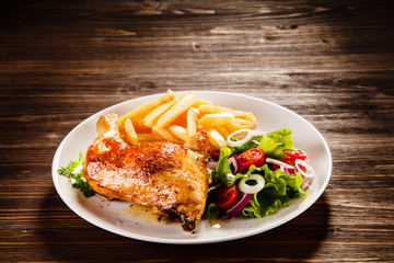 Roast chicken leg with french fries
