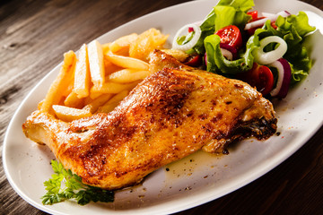 Roast chicken leg with french fries