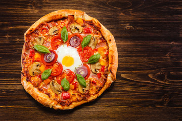 Pizza with egg and mushrooms