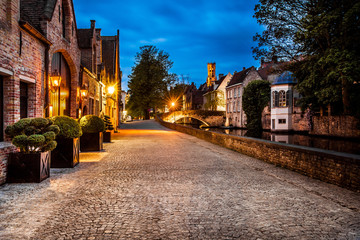 Fototapeta na wymiar Night view of Bruges street, Belgium, nightshot of Brugge canals, traditional belgium architecture