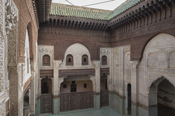 MEKNES, MOROCCO - FEBRUARY 18, 2017: Madrasa Bou Inania interior in Meknes, Morocco. Madrasa Bou Inania is acknowledged as an excellent example of Marinid architecture in Meknes