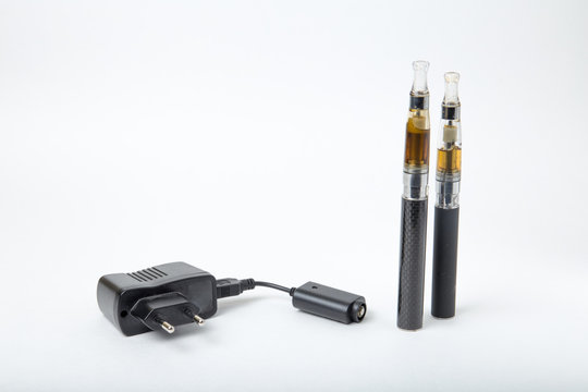 2 Electronic cigarettes with charger on white background