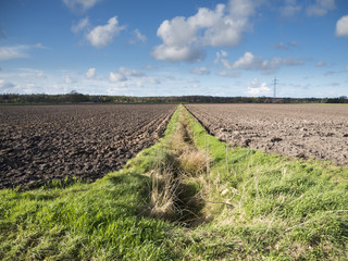 plowed field with ditch