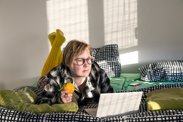 Person using Computer relaxing on Bed