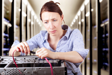 Woman looking confused repairing hardware