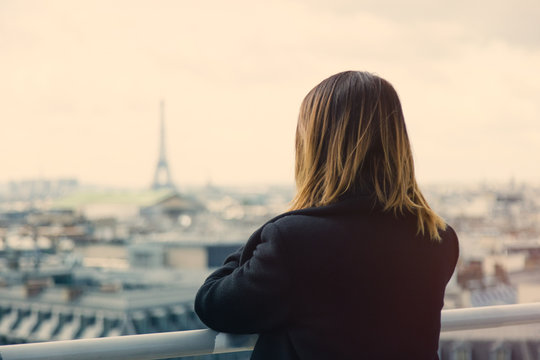young woman looking at Paris